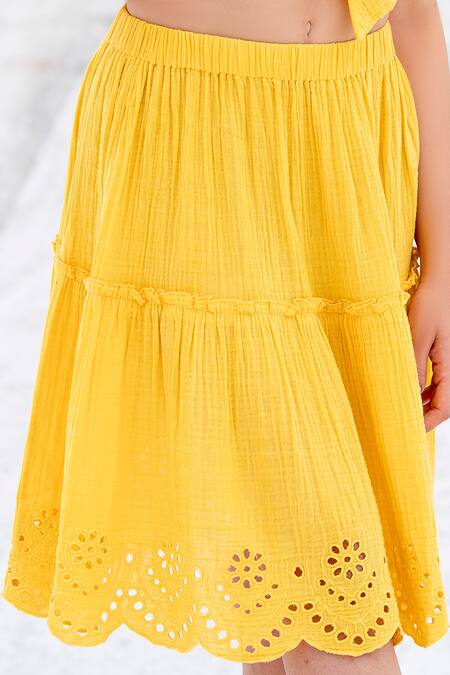 Shop Beachbum Yellow Cotton Cut Work Plunge Neck Sun Schiffli Skirt And Tie Top Set Online at Aza Fashions Shop_Beachbum_Yellow Cotton Cut Work Plunge Neck Sun Schiffli Skirt And Tie Top Set _Online_at_Aza_Fashions