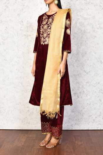 Samyukta Singhania Maroon Velvet, Chanderi Embroidery, Cut Work Round Neck Floral Kurta Pant Set at Aza Fashions Samyukta Singhania_Maroon Velvet, Chanderi Embroidery, Cut Work Round Neck Floral Kurta Pant Set _at_Aza_Fashions