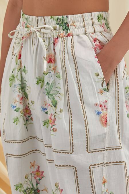 Shop_Pozruh By Aiman_White Cotton Bouquet Floral Print Trousers _Online_at_Aza_Fashions