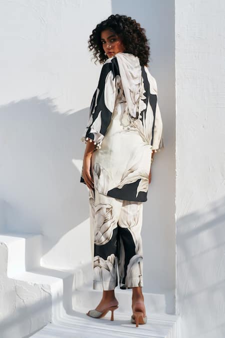 Shop Rainas Black Cotton, Linen Pom-poms, Tassels Round Neck Floral Print Earthen Petals Set at Aza Fashions Shop_Rainas_Black Cotton, Linen Pom-poms, Tassels Round Neck Floral Print Earthen Petals Set _at_Aza_Fashions