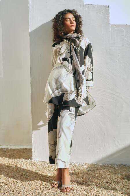 Buy Rainas Black Cotton, Linen Pom-poms, Tassels Round Neck Floral Print Earthen Petals Set Online at Aza Fashions Buy_Rainas_Black Cotton, Linen Pom-poms, Tassels Round Neck Floral Print Earthen Petals Set _Online_at_Aza_Fashions