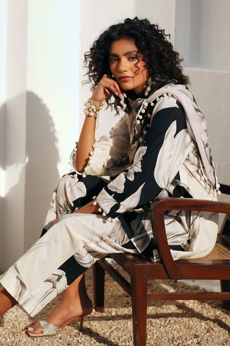 Shop Rainas Black Cotton, Linen Pom-poms, Tassels Round Neck Floral Print Earthen Petals Set Online at Aza Fashions Shop_Rainas_Black Cotton, Linen Pom-poms, Tassels Round Neck Floral Print Earthen Petals Set _Online_at_Aza_Fashions