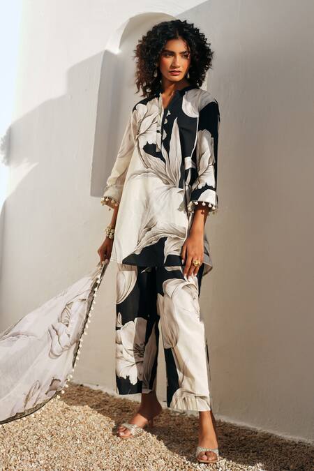 Buy Rainas Black Cotton, Linen Pom-poms, Tassels Round Neck Floral Print Earthen Petals Set Buy_Rainas_Black Cotton, Linen Pom-poms, Tassels Round Neck Floral Print Earthen Petals Set