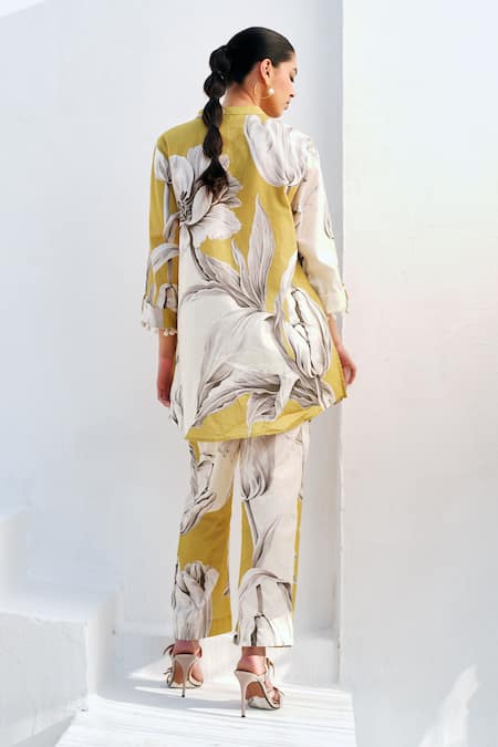 Shop Rainas Mustard Cotton, Linen Pom-poms Round Neck Bloom Kurta Pant Set at Aza Fashions Shop_Rainas_Mustard Cotton, Linen Pom-poms Round Neck Bloom Kurta Pant Set _at_Aza_Fashions