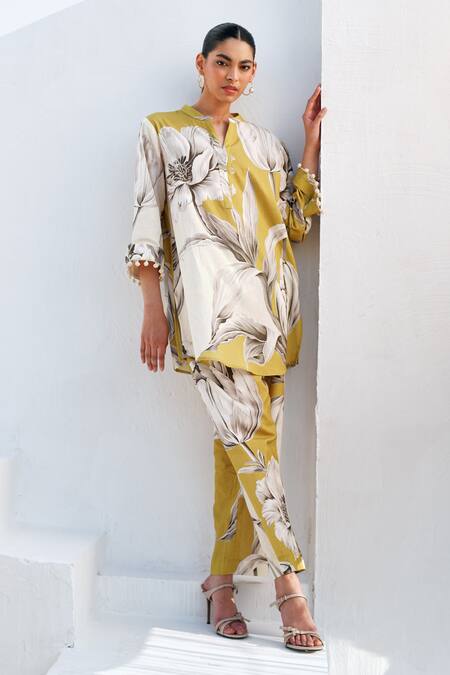 Shop Rainas Mustard Cotton, Linen Pom-poms Round Neck Bloom Kurta Pant Set Online at Aza Fashions Shop_Rainas_Mustard Cotton, Linen Pom-poms Round Neck Bloom Kurta Pant Set _Online_at_Aza_Fashions