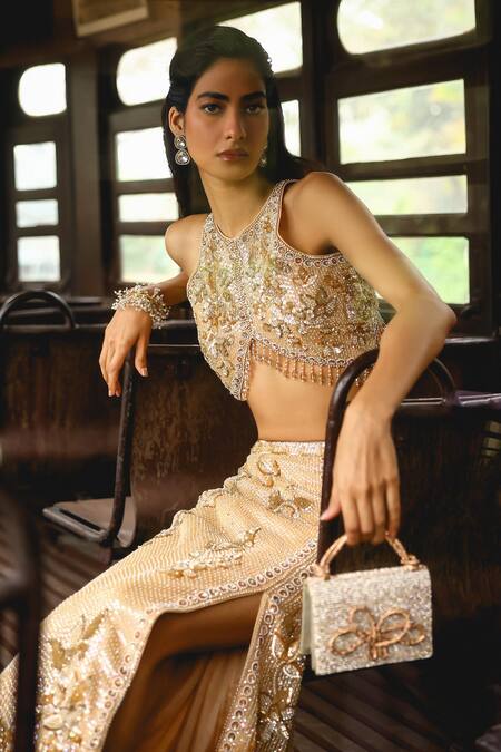 Sabe Peach Net Sequins, Beads Halter Neck Embroidered Skirt And Bustier Set at Aza Fashions Sabe_Peach Net Sequins, Beads Halter Neck Embroidered Skirt And Bustier Set _at_Aza_Fashions