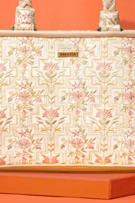Amyra_Off White Embroidery Mogra Handbag _at_Aza_Fashions