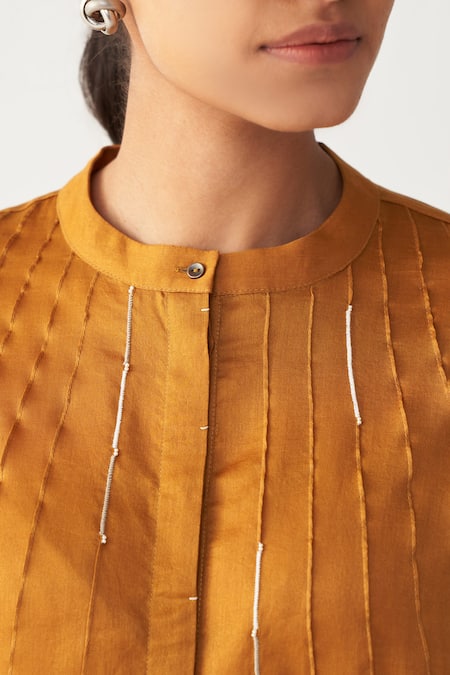 Shop_Three_Mustard Chanderi, Crepe Beads Round Neck Pintuck Bat Sleeve Shirt _Online_at_Aza_Fashions