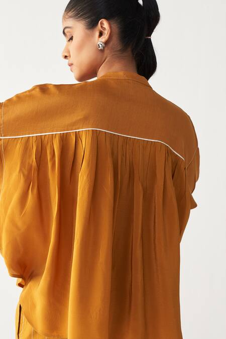 Three_Mustard Chanderi, Crepe Beads Round Neck Pintuck Bat Sleeve Shirt _at_Aza_Fashions