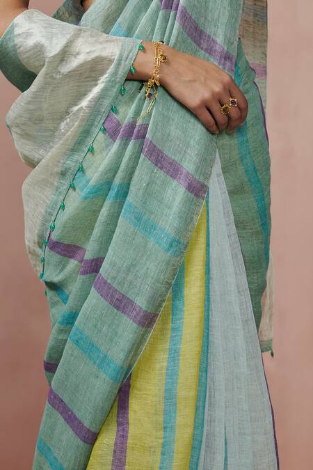 Dressfolk Blue Linen V-neck Handloom Saree With Blouse at Aza Fashions Dressfolk_Blue Linen V-neck Handloom Saree With Blouse_at_Aza_Fashions
