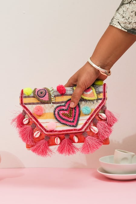 Shop_The Purple Sack_Pink Pom-poms, Tassels Boho Eye Clutch _Online_at_Aza_Fashions