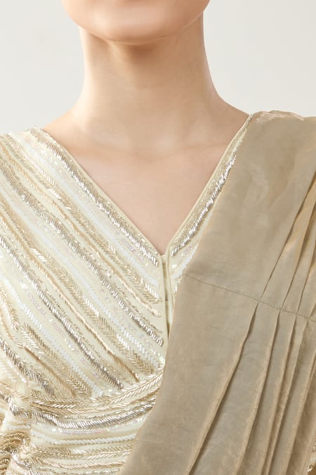 Samyukta Singhania_Beige Chinon Beads V-neck Embellished Pre-draped Saree Set _at_Aza_Fashions