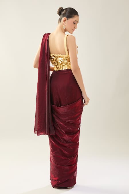 Shop Samyukta Singhania Maroon Chinon Sequins Sweetheart Neck Pre-draped Saree Set With Golden Blouse at Aza Fashions Shop_Samyukta Singhania_Maroon Chinon Sequins Sweetheart Neck Pre-draped Saree Set With Golden Blouse _at_Aza_Fashions