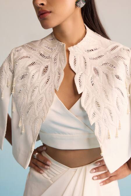 House Of Armuse Ivory Neoprene Pearls, Embroidery V-neck Threadworm Cape And Skirt Set Online at Aza Fashions House Of Armuse_Ivory Neoprene Pearls, Embroidery V-neck Threadworm Cape And Skirt Set _Online_at_Aza_Fashions