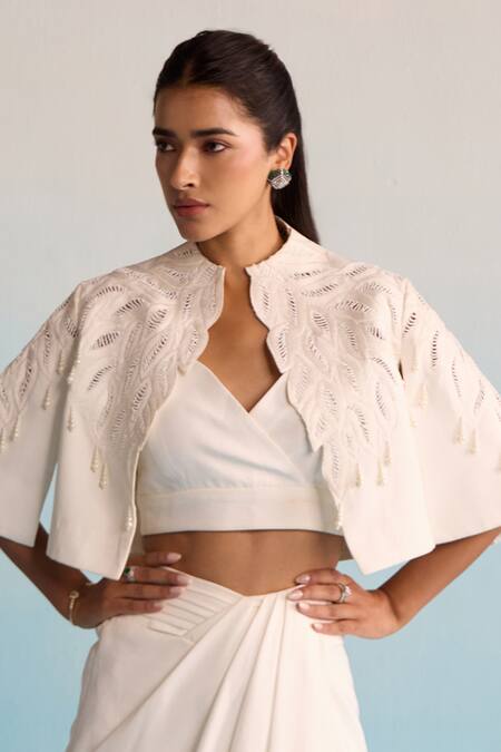 House Of Armuse Ivory Neoprene Pearls, Embroidery V-neck Threadworm Cape And Skirt Set at Aza Fashions House Of Armuse_Ivory Neoprene Pearls, Embroidery V-neck Threadworm Cape And Skirt Set _at_Aza_Fashions