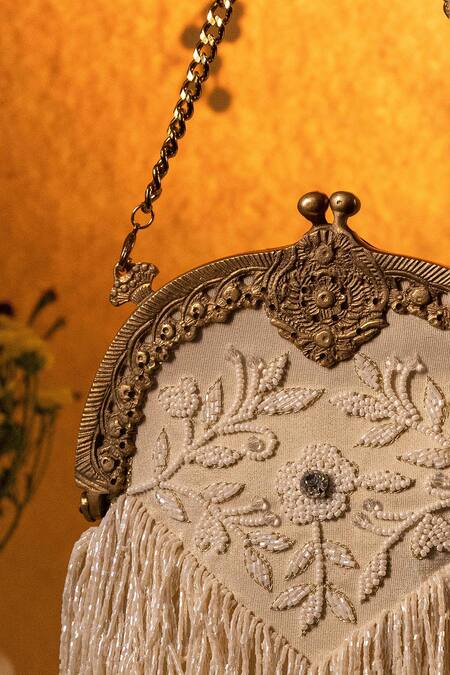 Be Chic_Ivory Embroidery, Tassels Heer Potli Bag _Online_at_Aza_Fashions