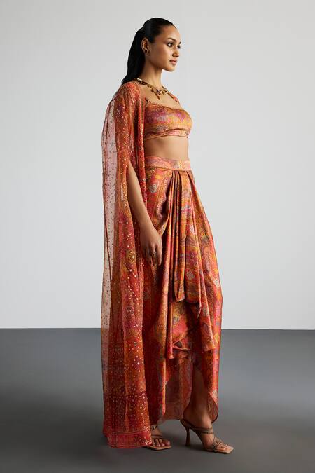 Shop RI.Ritu Kumar Coral , Satin Sequins Multi Print Cape Bustier Skirt Set Online at Aza Fashions Shop_RI.Ritu Kumar_Coral , Satin Sequins Multi Print Cape Bustier Skirt Set _Online_at_Aza_Fashions