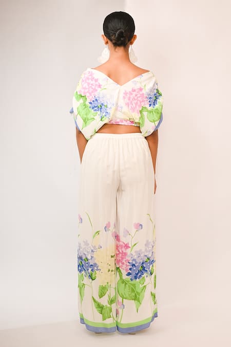 Shop Rimi Nayak White Viscose, Crepe Pearls V-neck Floral Printed Top And Trouser Set at Aza Fashions Shop_Rimi Nayak_White Viscose, Crepe Pearls V-neck Floral Printed Top And Trouser Set _at_Aza_Fashions