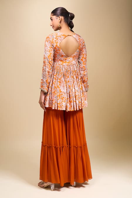 Shop Samyukta Singhania Orange Crepe Round Neck Floral Peplum Kurta And Gharara Set at Aza Fashions Shop_Samyukta Singhania_Orange Crepe Round Neck Floral Peplum Kurta And Gharara Set _at_Aza_Fashions
