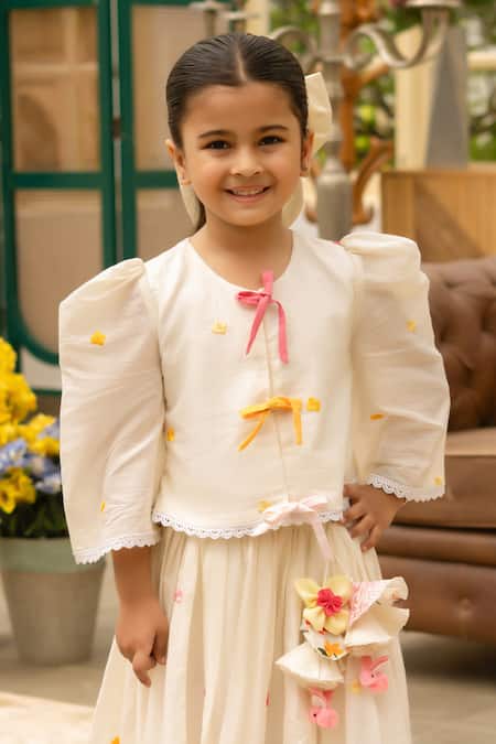 Fayon Kids Off White Cotton Fabric Flowers, Pom-poms Designer Lehenga And Blouse Set Online at Aza Fashions Fayon Kids_Off White Cotton Fabric Flowers, Pom-poms Designer Lehenga And Blouse Set _Online_at_Aza_Fashions