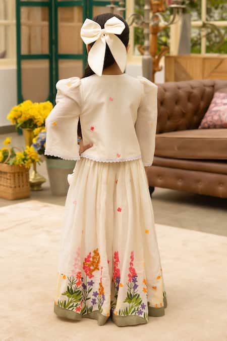 Shop Fayon Kids Off White Cotton Fabric Flowers, Pom-poms Designer Lehenga And Blouse Set at Aza Fashions Shop_Fayon Kids_Off White Cotton Fabric Flowers, Pom-poms Designer Lehenga And Blouse Set _at_Aza_Fashions