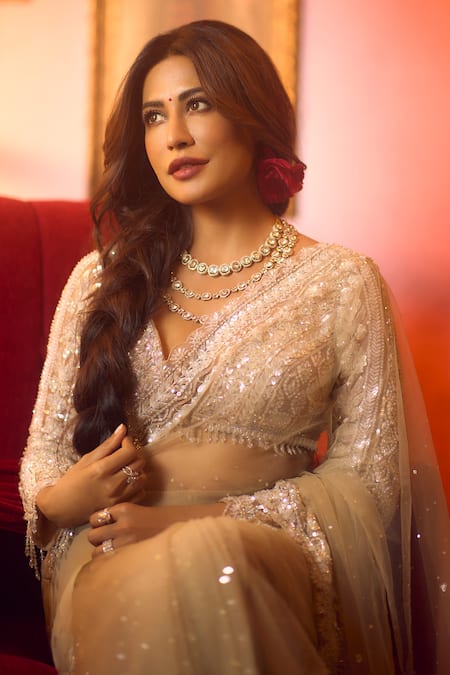 Seema Gujral_Beige Net Sequins, Crystals, Tassels Plunge Neck Embroidered Saree Set _at_Aza_Fashions