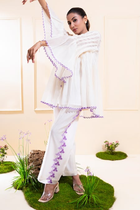 The White Tree Studio_White Chanderi Embroidery, Cut Work, Applique V-neck Smocking Co-ord Set _at_Aza_Fashions