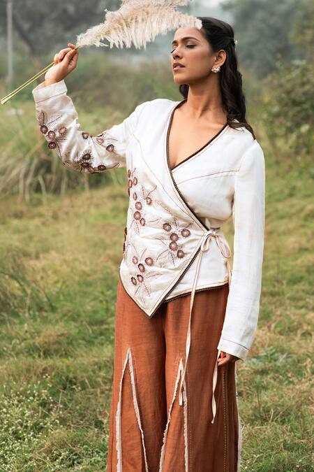 Kushani Ivory Satin, Linen Embroidery V-neck Wrap Top And Mocha Brown Trousers Online at Aza Fashions Kushani_Ivory Satin, Linen Embroidery V-neck Wrap Top And Mocha Brown Trousers _Online_at_Aza_Fashions