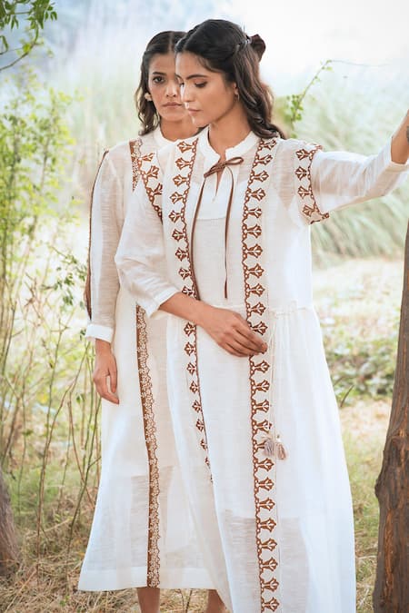 Shop_Kushani_Ivory Linen, Silk Beads, Tassels Open Neck Embroidered Dress _Online_at_Aza_Fashions