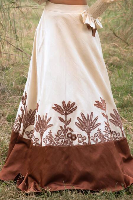 Shop_Kushani_Ivory Satin, Linen Tassels, Beads Round Neck Floral Serenity Lehenga Set _Online_at_Aza_Fashions