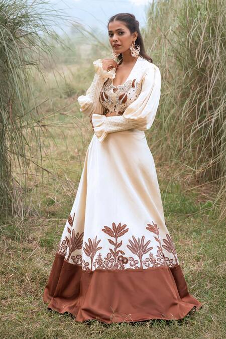 Kushani_Ivory Satin, Linen Tassels, Beads Round Neck Floral Serenity Lehenga Set _at_Aza_Fashions