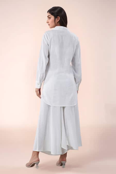 Shop Naintara Bajaj White Cotton Split V-neck Kurta And Pant Set at Aza Fashions Shop_Naintara Bajaj_White Cotton Split V-neck Kurta And Pant Set _at_Aza_Fashions