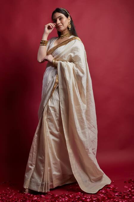 Vinusto Ivory Chanderi Cut Work And Gold Saree With Unstitched Blouse Piece Online at Aza Fashions Vinusto_Ivory Chanderi Cut Work And Gold Saree With Unstitched Blouse Piece _Online_at_Aza_Fashions