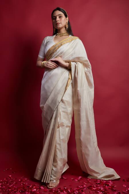 Vinusto Ivory Chanderi Cut Work And Gold Saree With Unstitched Blouse Piece at Aza Fashions Vinusto_Ivory Chanderi Cut Work And Gold Saree With Unstitched Blouse Piece _at_Aza_Fashions