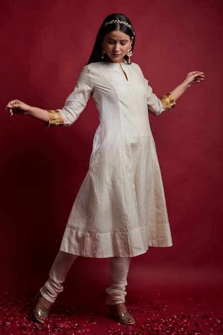 Shop Vinusto Ivory Chanderi, Cotton Cut Work Keyhole Neck And Gold Striped Anarkali Set at Aza Fashions Shop_Vinusto_Ivory Chanderi, Cotton Cut Work Keyhole Neck And Gold Striped Anarkali Set _at_Aza_Fashions