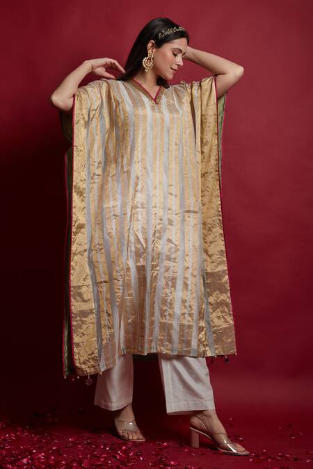 Vinusto Ivory Chanderi Tassels, Embroidery V-neck Gold Zari Stripe Kaftan And Pants Set at Aza Fashions Vinusto_Ivory Chanderi Tassels, Embroidery V-neck Gold Zari Stripe Kaftan And Pants Set _at_Aza_Fashions