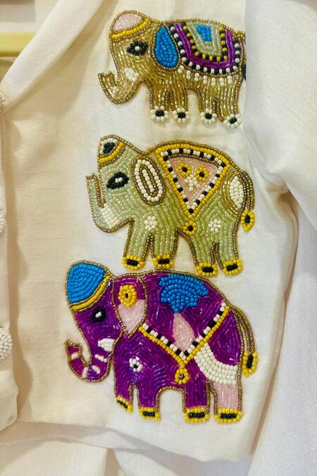 Shop Rage Attire-Sweta Saria Ivory Beads, Embroidery Elephant Lehenga Set Online at Aza Fashions Shop_Rage Attire-Sweta Saria_Ivory Beads, Embroidery Elephant Lehenga Set _Online_at_Aza_Fashions