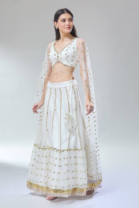 Shop_Divya Kanakia_Ivory Net, Silk Satin Sequins, Embroidery V-neck Lehenga And Blouse Set _Online_at_Aza_Fashions