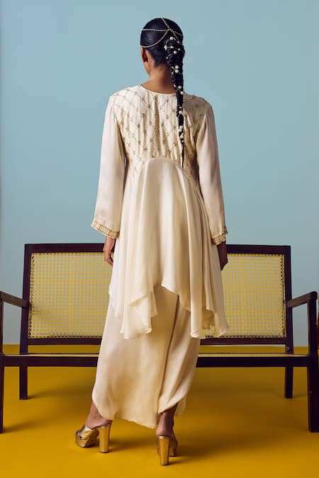 Shop Prahnaaya White Satin, Silk Beads, Pearls, Sequins Asymmetric Flared Tunic And Skirt Set at Aza Fashions Shop_Prahnaaya_White Satin, Silk Beads, Pearls, Sequins Asymmetric Flared Tunic And Skirt Set _at_Aza_Fashions