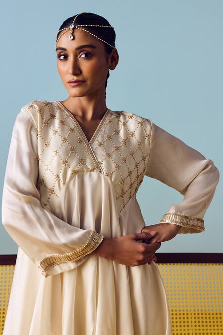 Prahnaaya White Satin, Silk Beads, Pearls, Sequins Asymmetric Flared Tunic And Skirt Set Online at Aza Fashions Prahnaaya_White Satin, Silk Beads, Pearls, Sequins Asymmetric Flared Tunic And Skirt Set _Online_at_Aza_Fashions