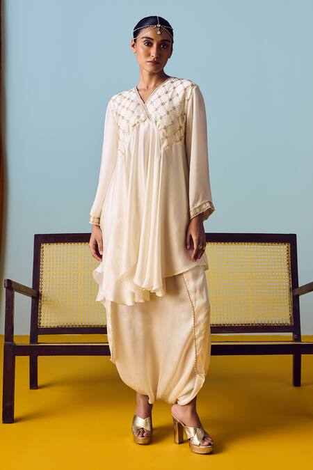 Shop Prahnaaya White Satin, Silk Beads, Pearls, Sequins Asymmetric Flared Tunic And Skirt Set Online at Aza Fashions Shop_Prahnaaya_White Satin, Silk Beads, Pearls, Sequins Asymmetric Flared Tunic And Skirt Set _Online_at_Aza_Fashions