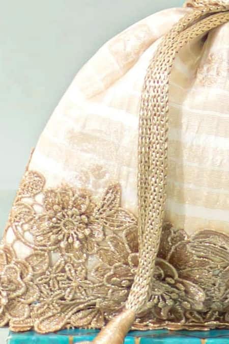 Buy_Amyra_Off White Zari Parijat Silk Potli _Online_at_Aza_Fashions