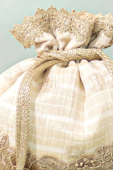 Amyra_Off White Zari Parijat Silk Potli _at_Aza_Fashions