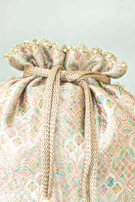 Amyra_Multi Color Tassels, Pearls Chakori Pure Banarasi Silk Potli _at_Aza_Fashions