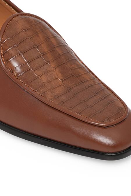 NR By Nidhi Rathi_Tan Textured Patent Slip-on Loafers_at_Aza_Fashions