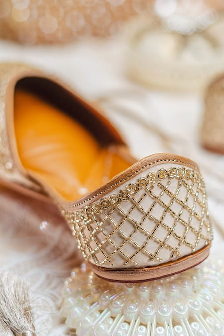 Shop_NR By Nidhi Rathi_Gold Gold-toned Leather Embroidered Juttis _Online_at_Aza_Fashions