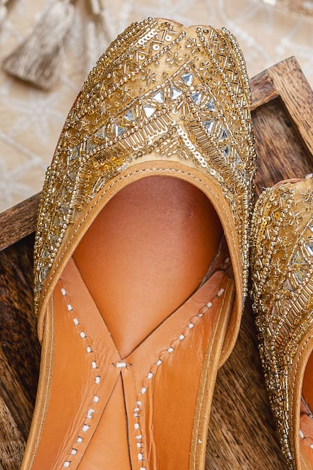 Shop_NR By Nidhi Rathi_Gold Gold-toned Embroidered Flat Juttis 
