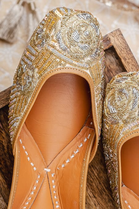 Shop_NR By Nidhi Rathi_Gold Gold-toned Embroidered Flat Juttis 