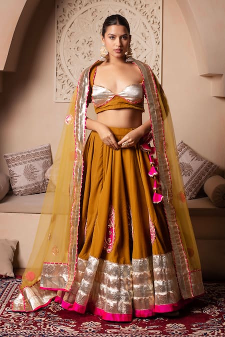 Pomcha Jaipur Mustard Velvet, Net Tassels Round Neck Lehenga Set 