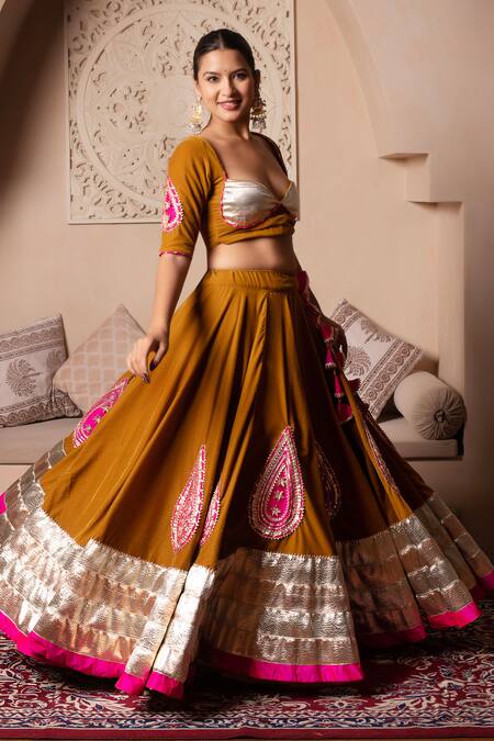 Shop_Pomcha Jaipur_Mustard Velvet, Net Tassels Round Neck Lehenga Set _Online_at_Aza_Fashions